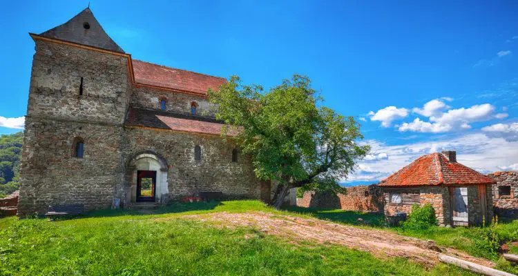 Fantastic summer view of Fortified Lutheran Church St. Michael on top of rock hill in Cisnadioara near Sibiu, Romania, Europe