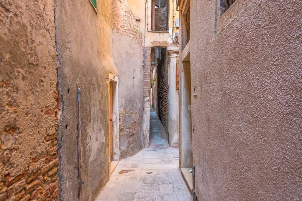 The narrowest street in the city of Venice is Calle varisco.