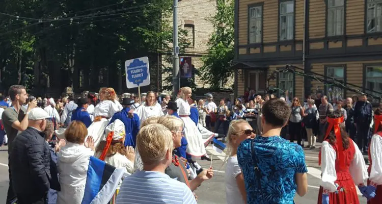 If you look carefully, you can see that the female dancers are sitting on the arms of the men, who are rotating in a circle as they march forward!