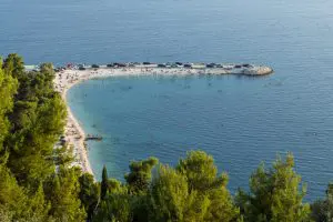 Popular beach at the Marjan peninsula in Split, Croatia, viewed from above.