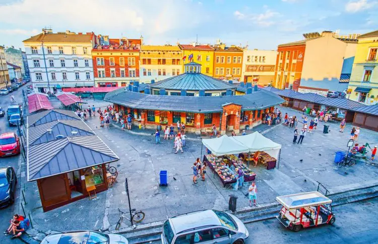 Krakow, Poland - June 21, 2018: The rainbow in the sky over the New Square (Plac Nowy) in Kazimierz Jewish Quarter, famous for its flea market and historical objects, on June 21 in Krakow.
