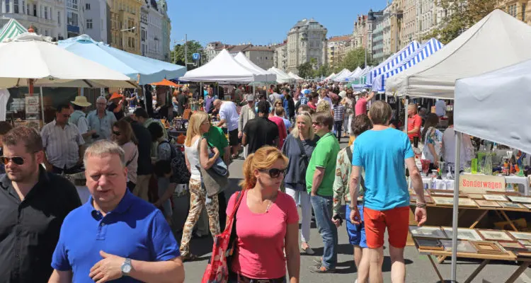 VIENNA, AUSTRIA - JULY 11, 2015: People Shopping at Naschmarkt Saturday Flea Market in Vienna, Austria.