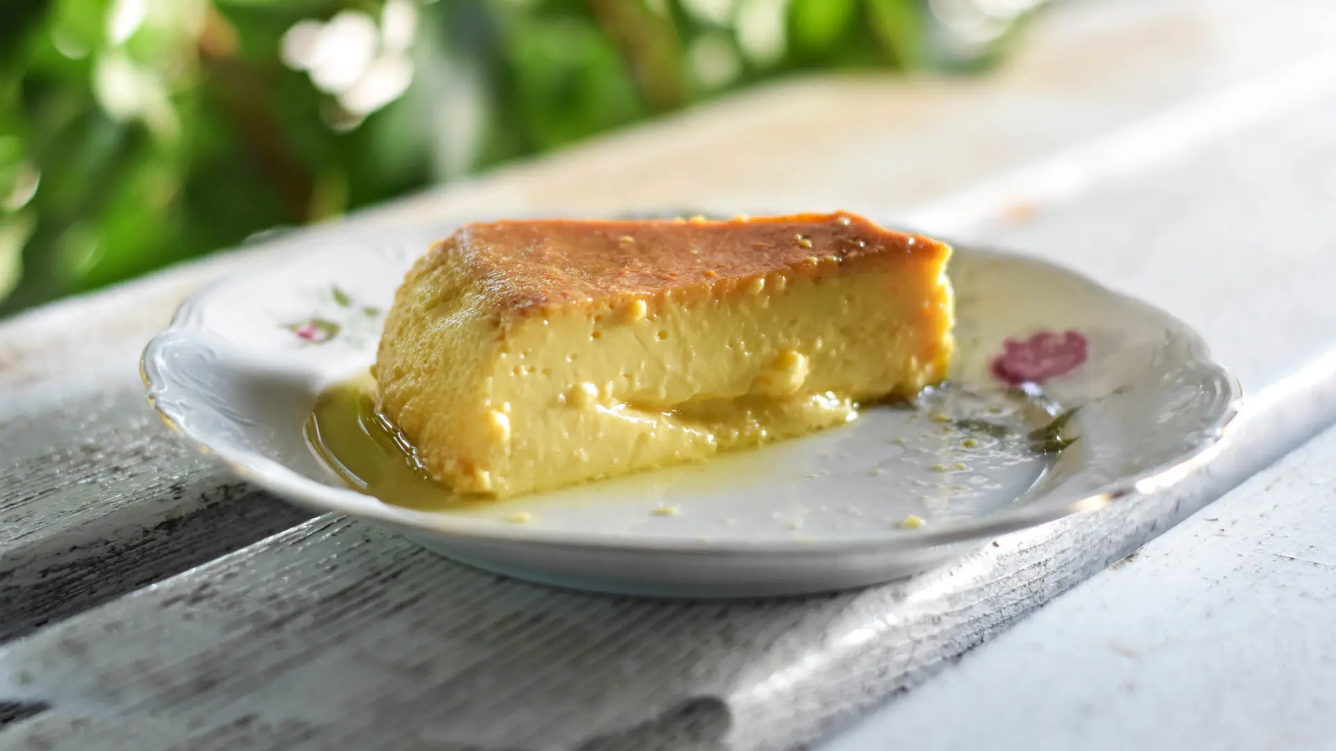 A piece of a creamy dessert on a white plate.