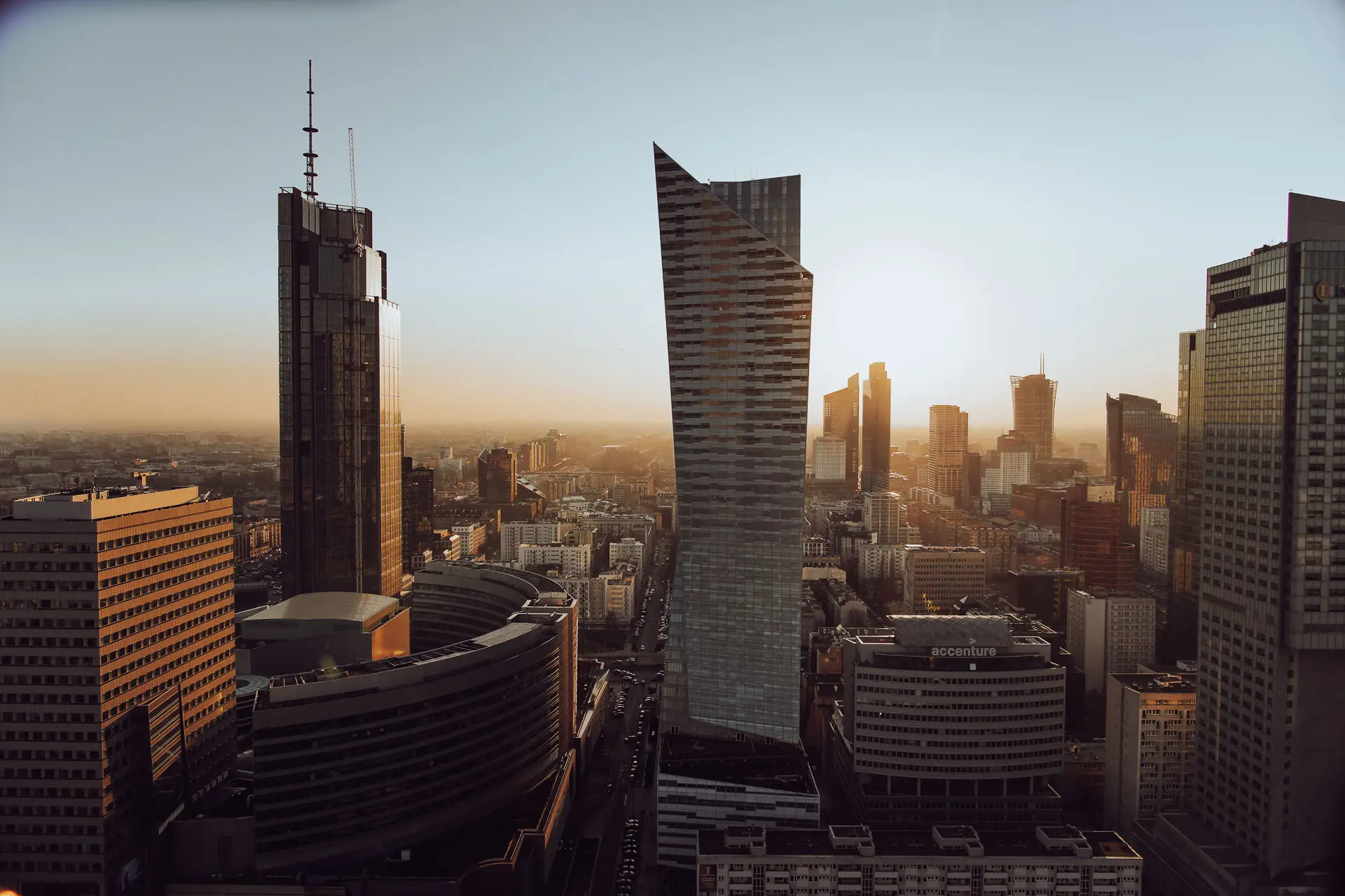 A view of Warsaw skyscrapers as seen from the Palace of Culture and Science's 30th-floor observation deck at sunset. The current tallest building in Warsaw, Varso Tower, is seen on the left. The controversial Zlota 44 skyscraper is in the middle.