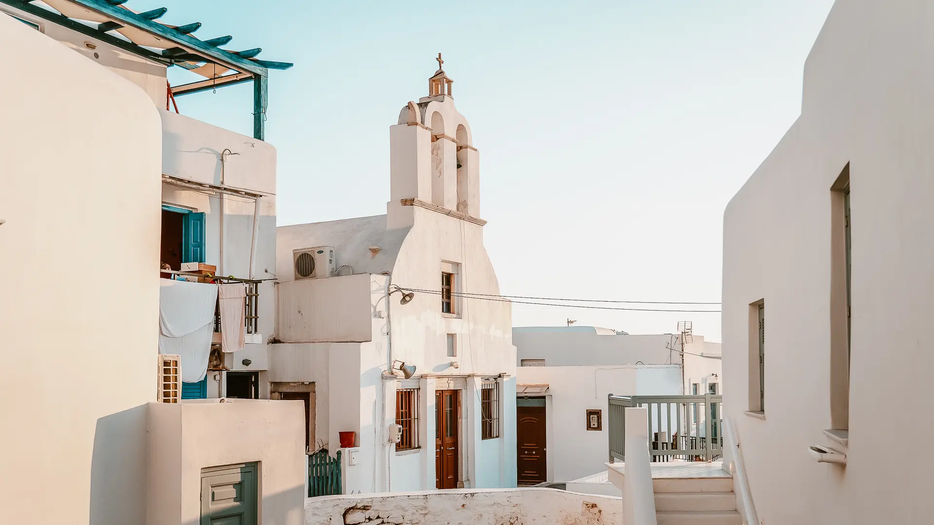 This is a photo of some whitewashed buildings, including a church, in Naxos Town.