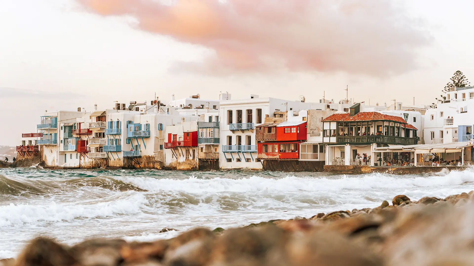 This image shows the whitewashed buildings with the colorful wooden balconies at Little Venice.