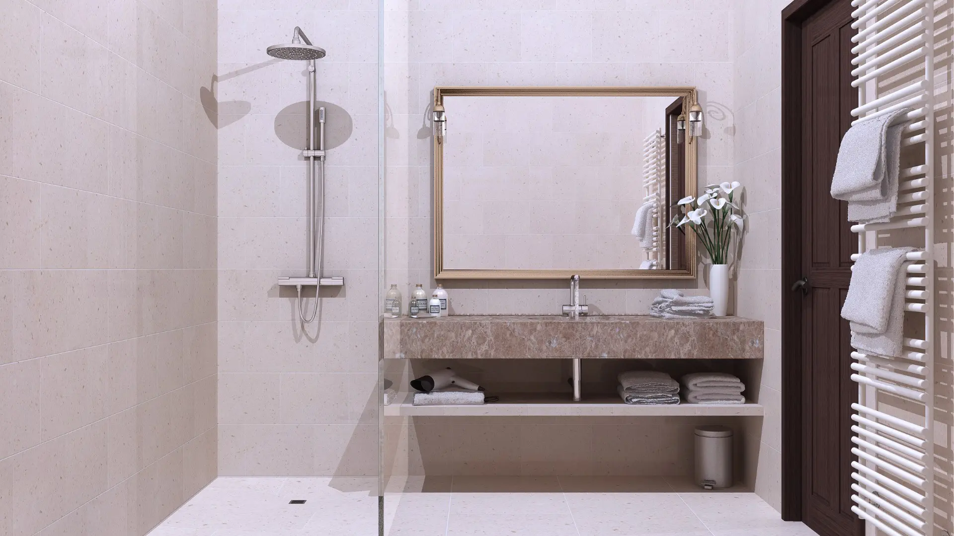 This image shows a hotel bathroom with a walk-in shower, a sink, a mirror and a towel warmer on the wall. Featuring walk-in showers instead of bathtubs is one of the main differences between American and European hotels.