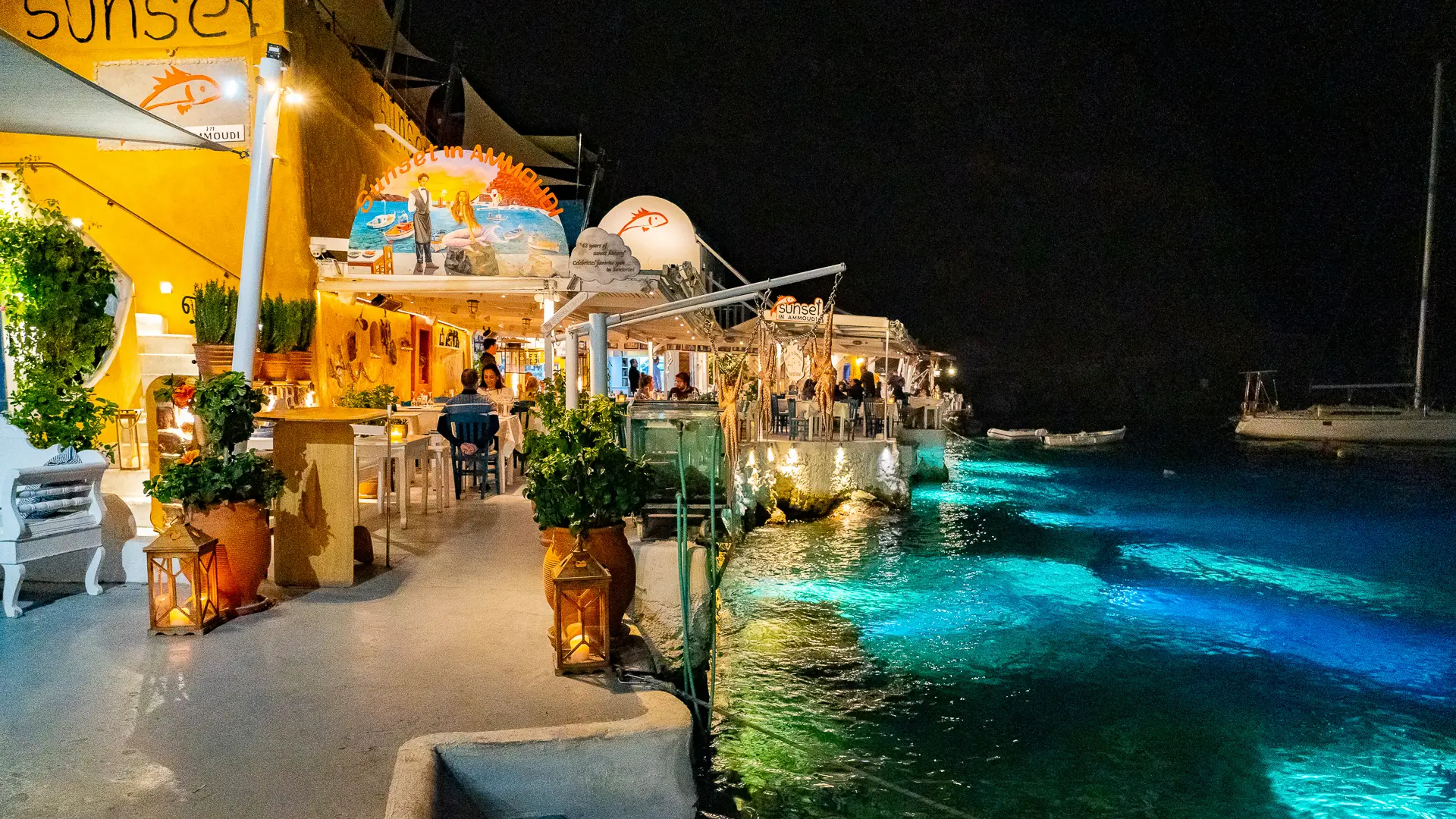This is a night shot of the traditional restaurants that line Ammoudi Bay. For exclusive moments, Santorini should answer the question Which Greek Islands should I visit.