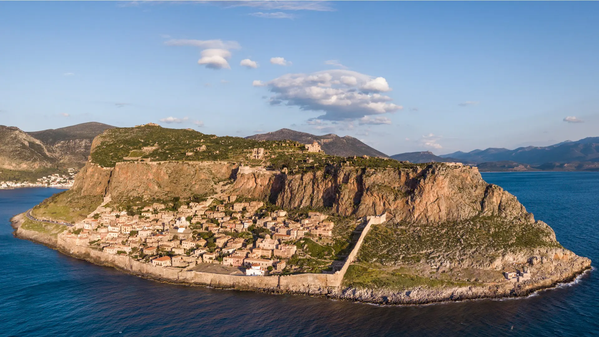 This is a panoramic view of the rock in the middle of the sea where Monemvasia is built.