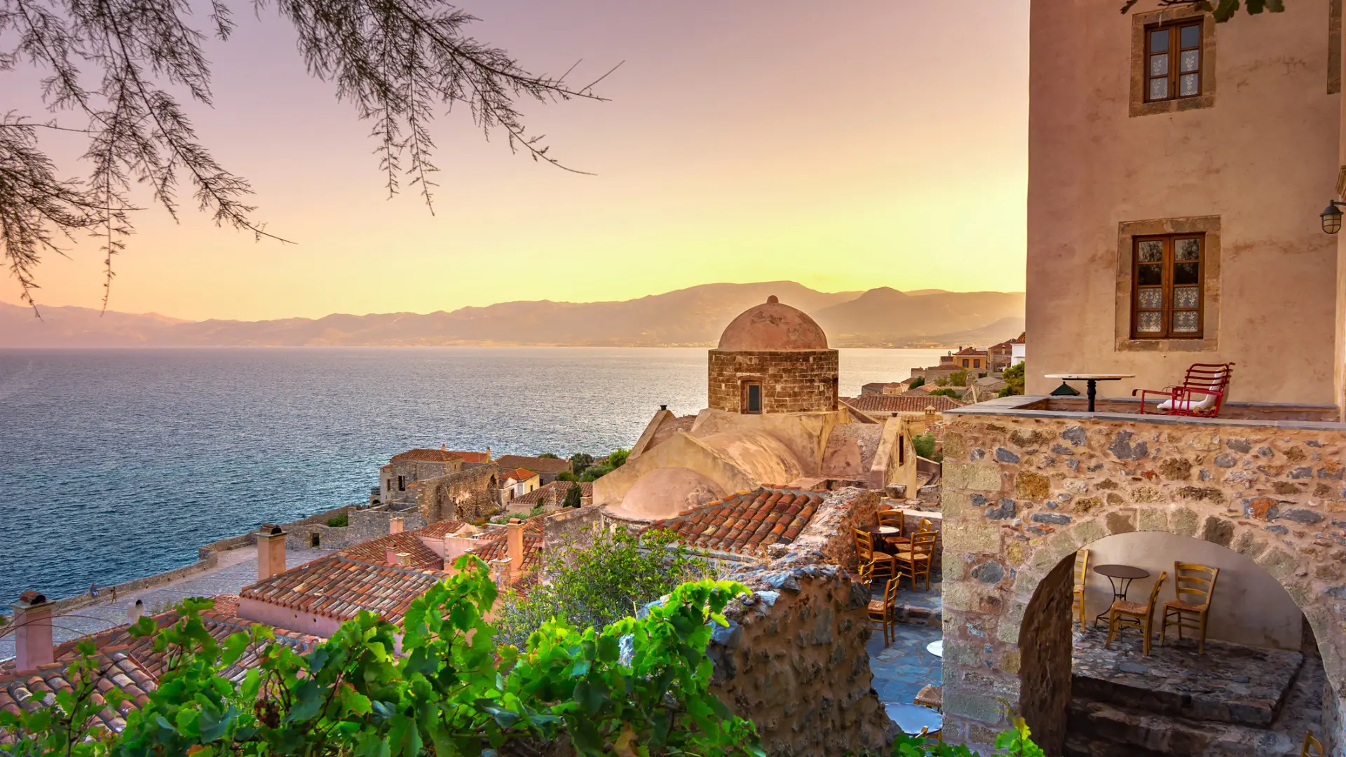 This is an image of the castle town of Monemvasia at sunset.
