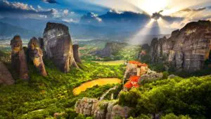 This is a panoramic shot of the Meteora rocks at sunset.