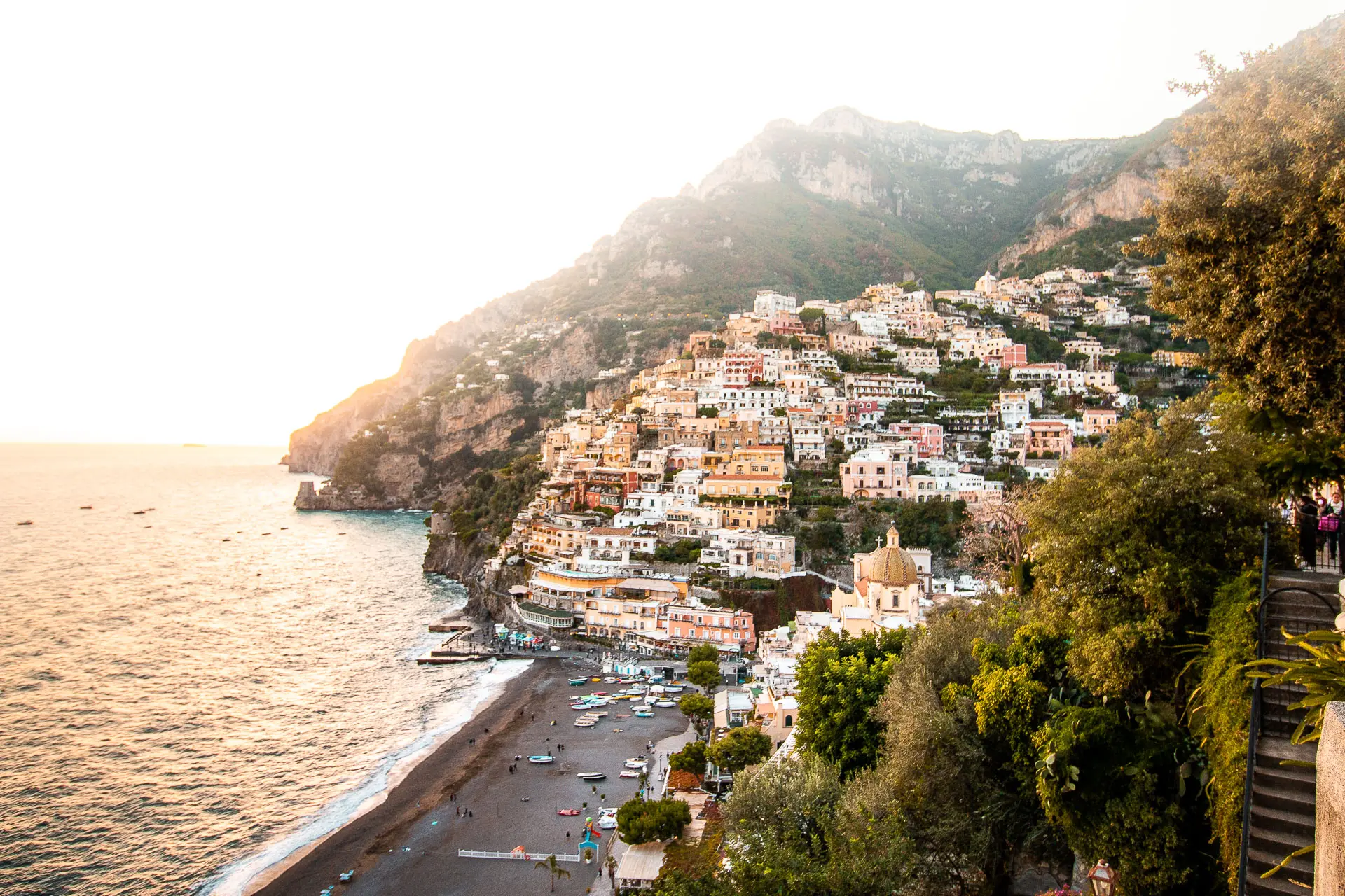 This is a panoramic view of Positano with its buildings perched on a steep slope by the sea.