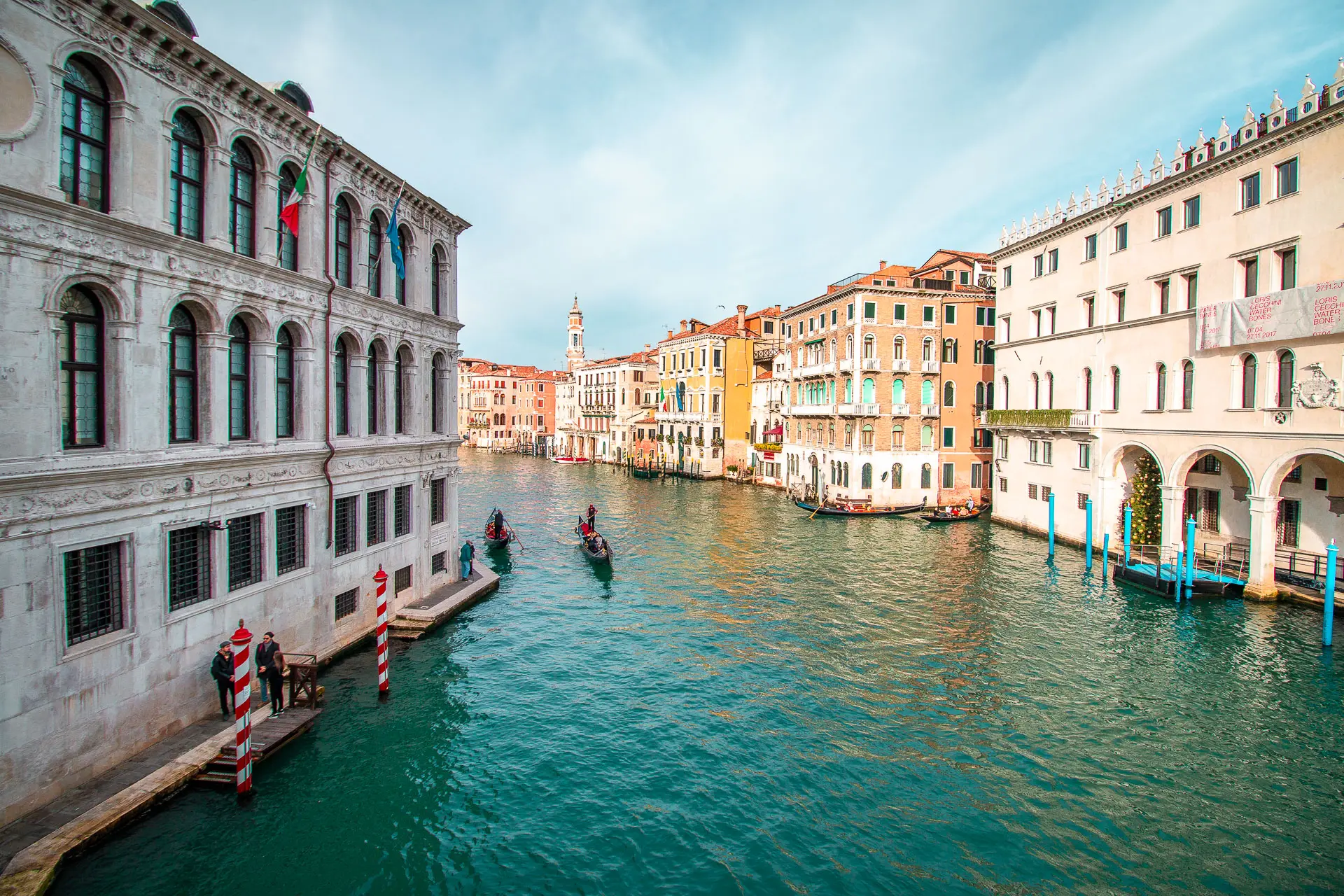 This image shows a canal in Venice lined by gorgeous buildings.