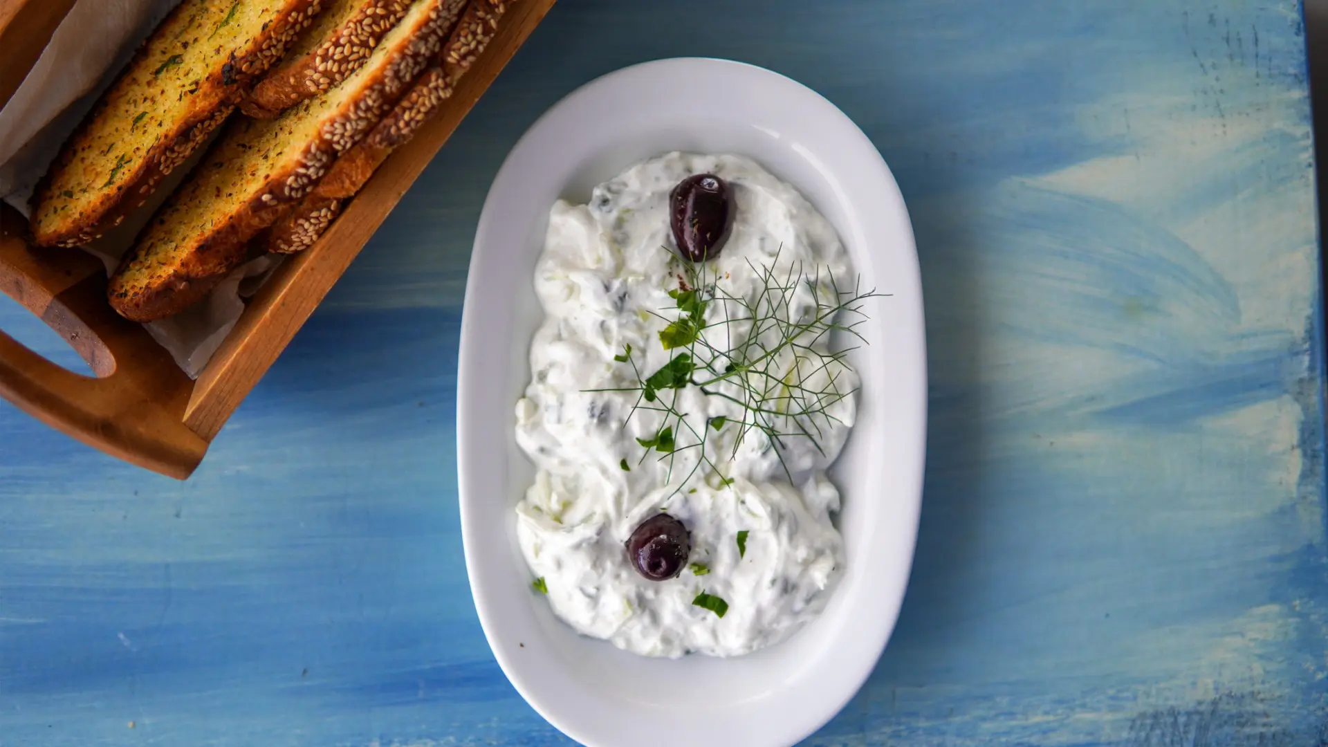 A top down of a small plate with Tzatziki.