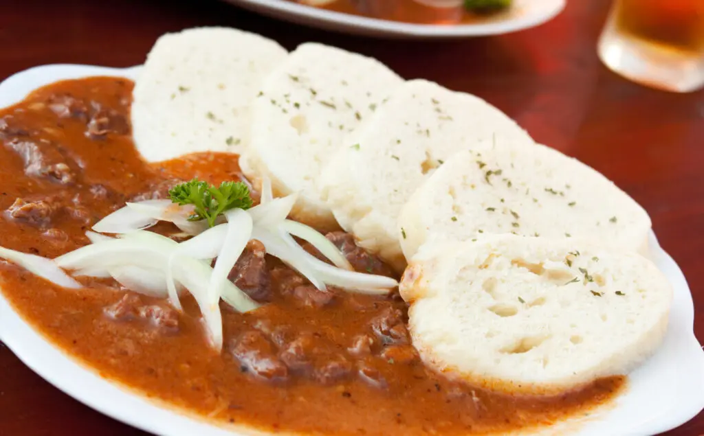 Beef goulash and bread dumplings (knedliky)