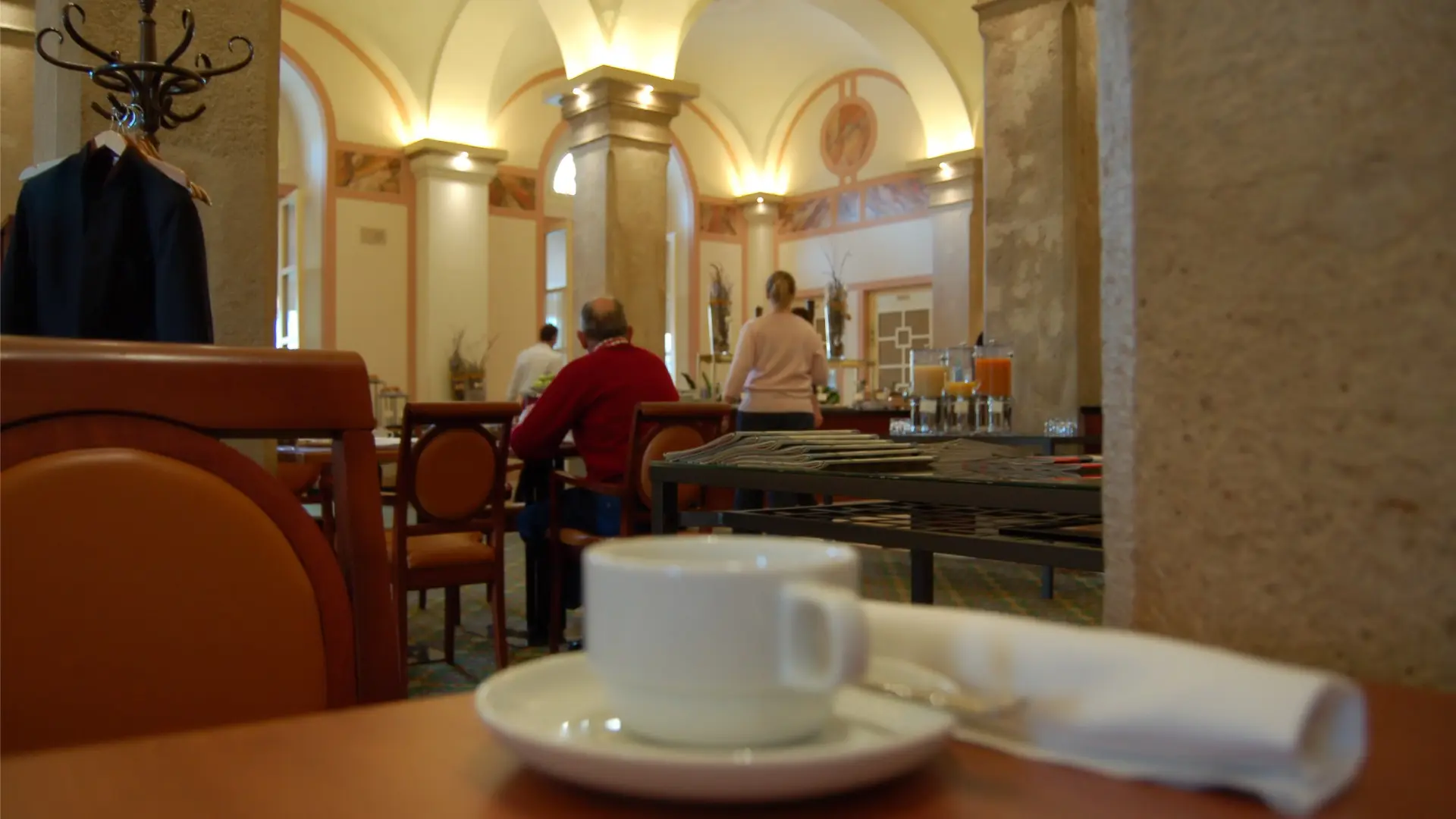 The interior of a Viennese coffee house with classic furniture.