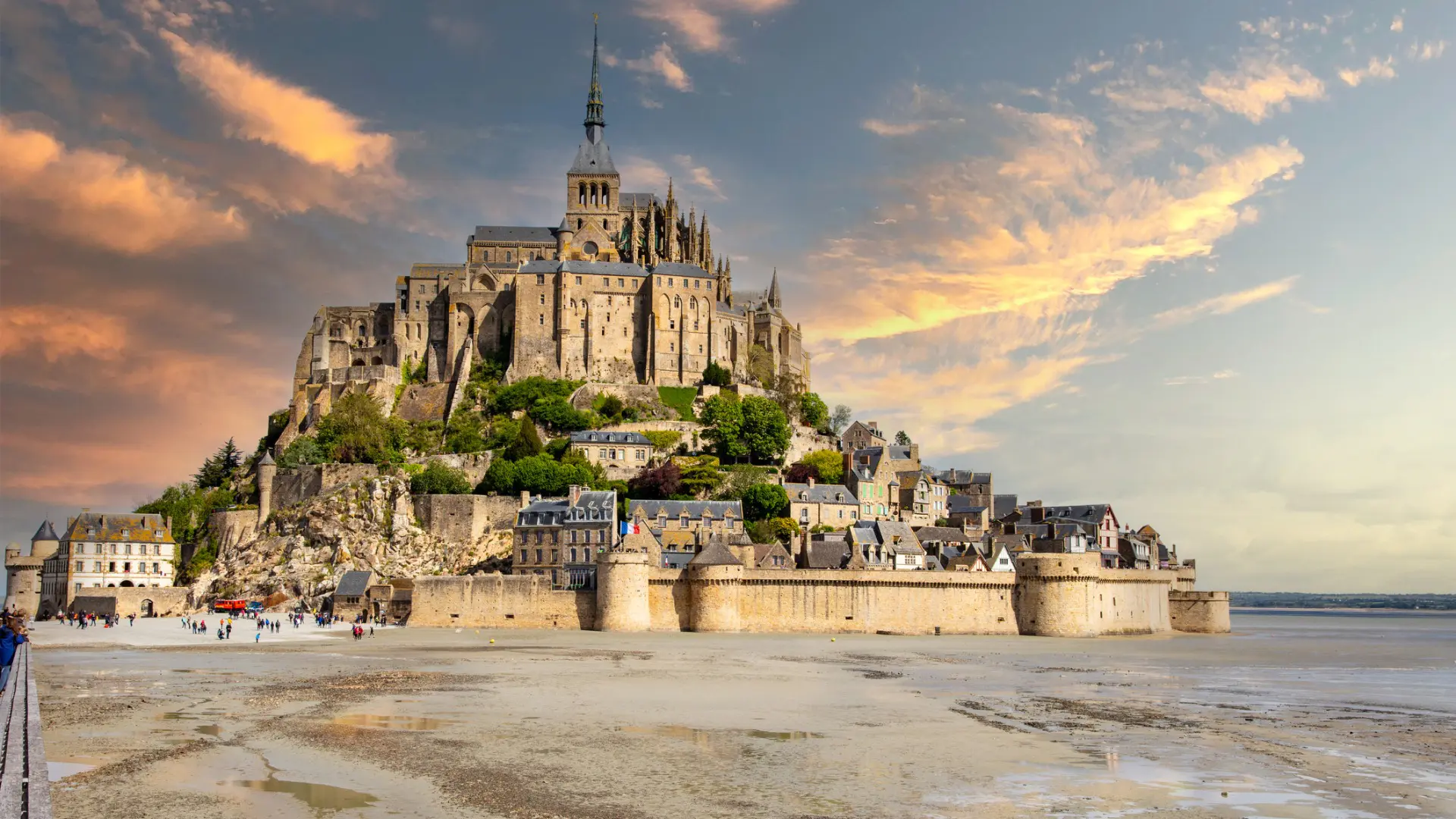 A castle built on a rock in the sand.