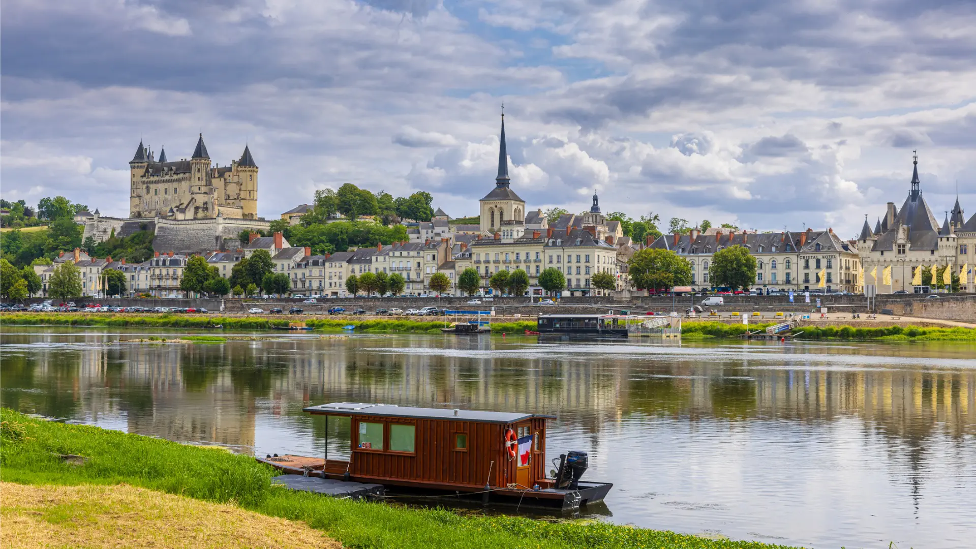 A beautiful town with castles and a river.