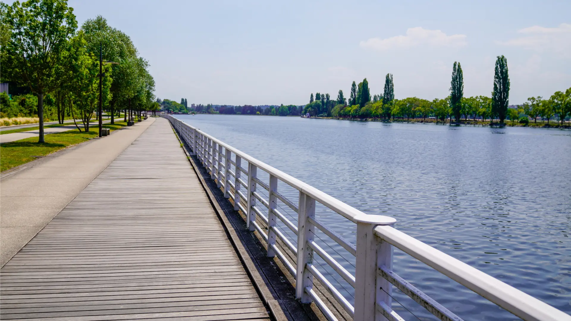 A wooden walkway next to a river in Vichy, one of the UNESCO World Heritage Sites in France.