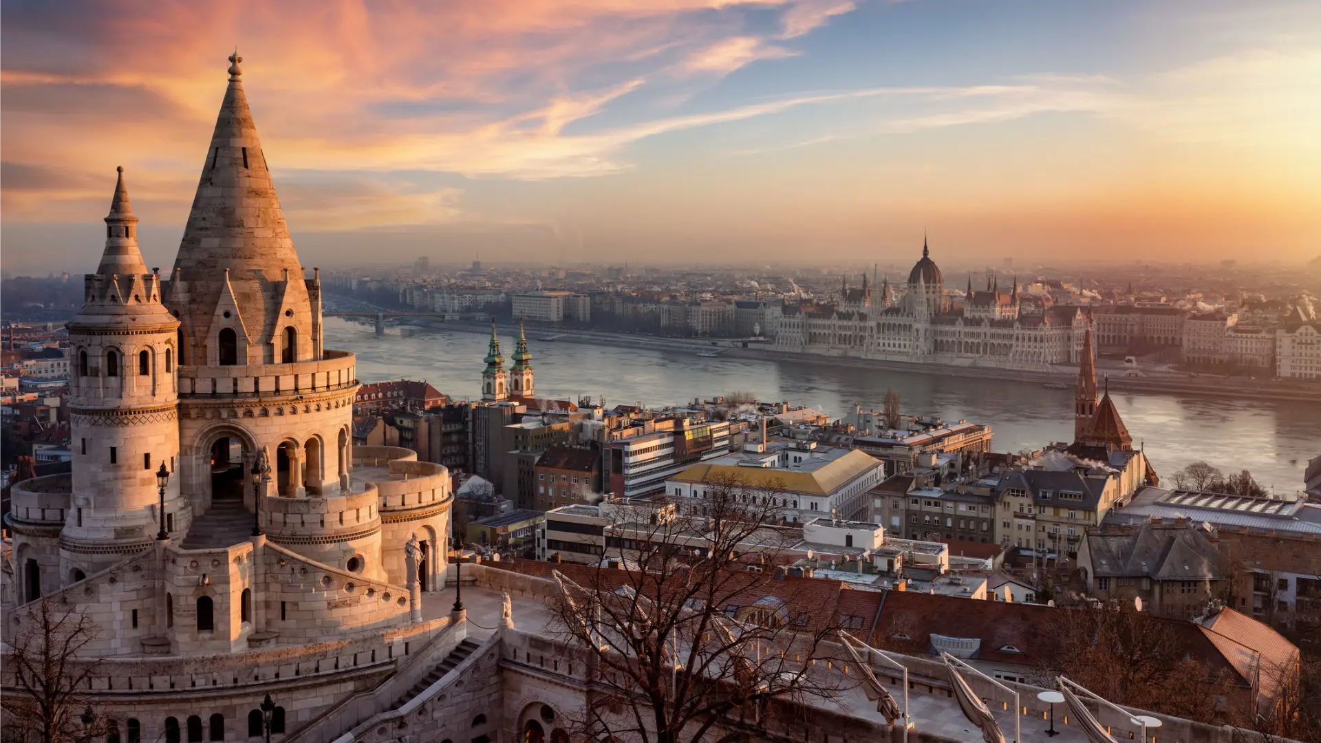 A panoramic view of Budapest with the Fisherman's Bastion in the foreground.