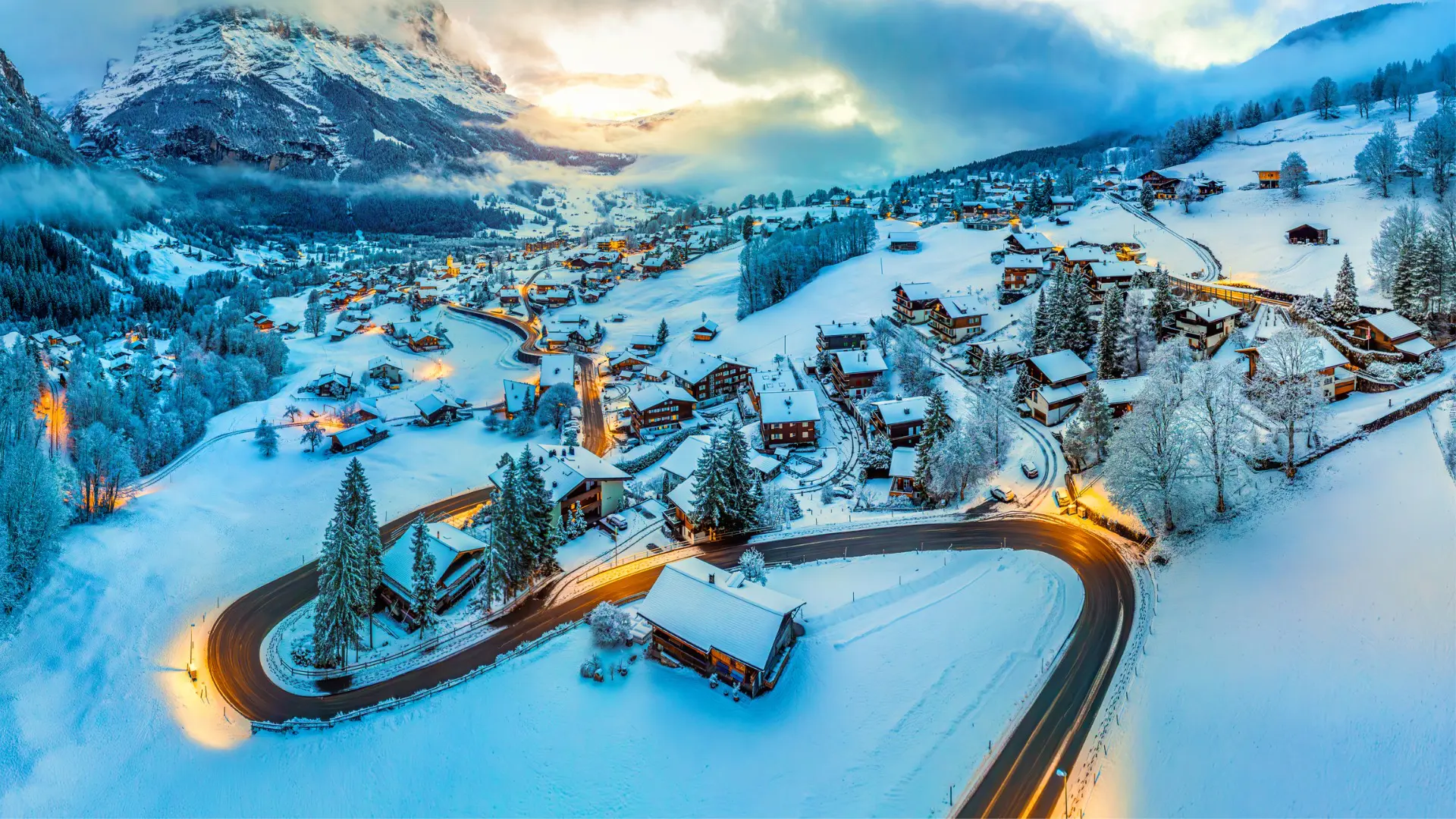 A panoramic view of a village in the snow.