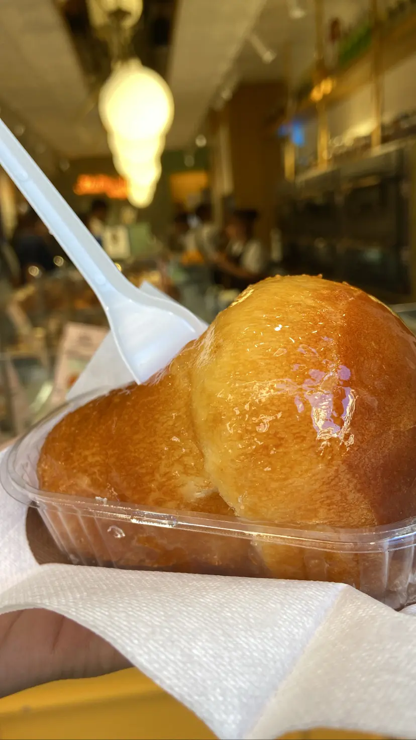 A close-up of a traditional baba, one of the best things to try if you're spending 36 hours in Naples.