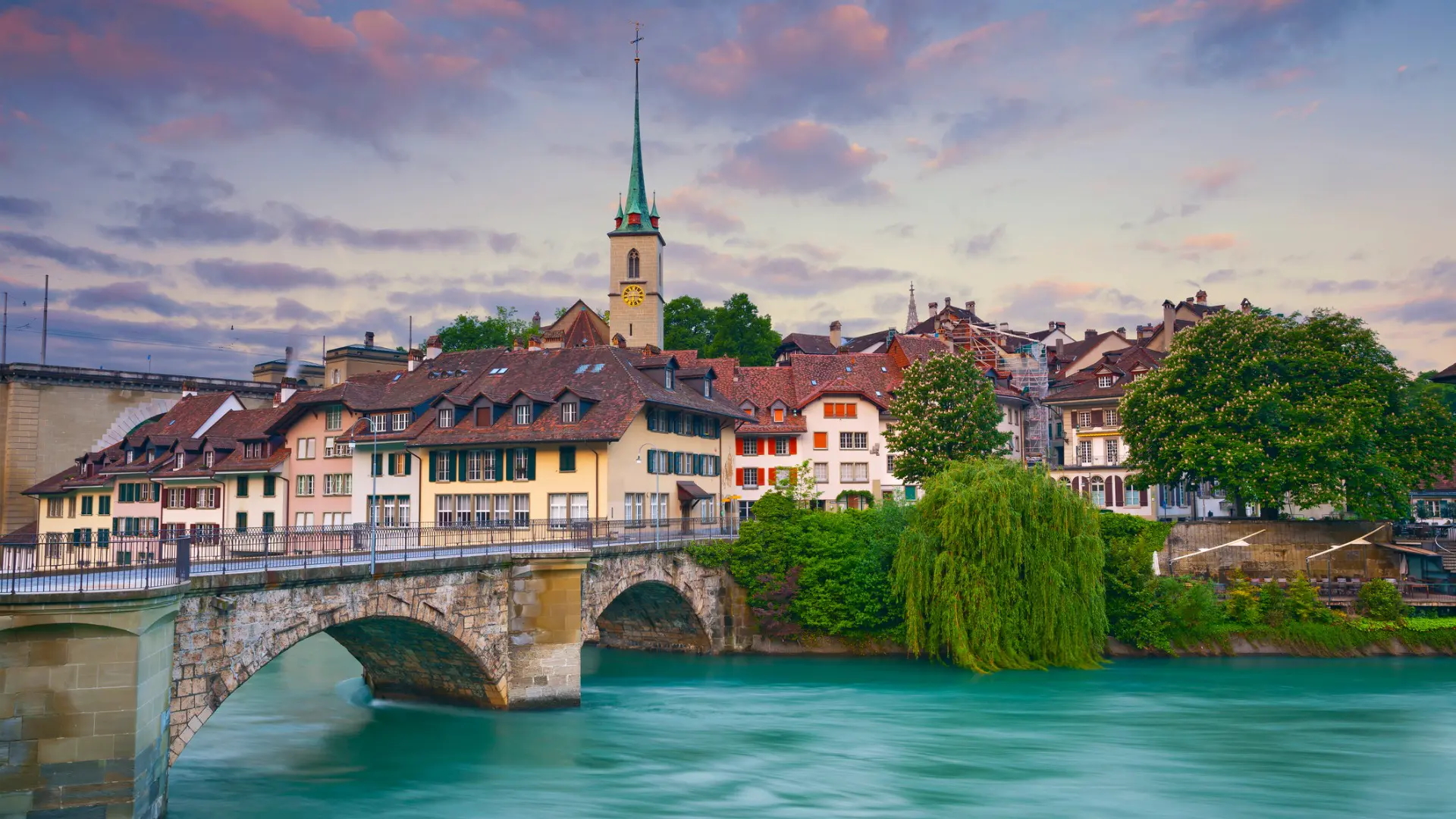 Traditional buildings and a bridge over a river.