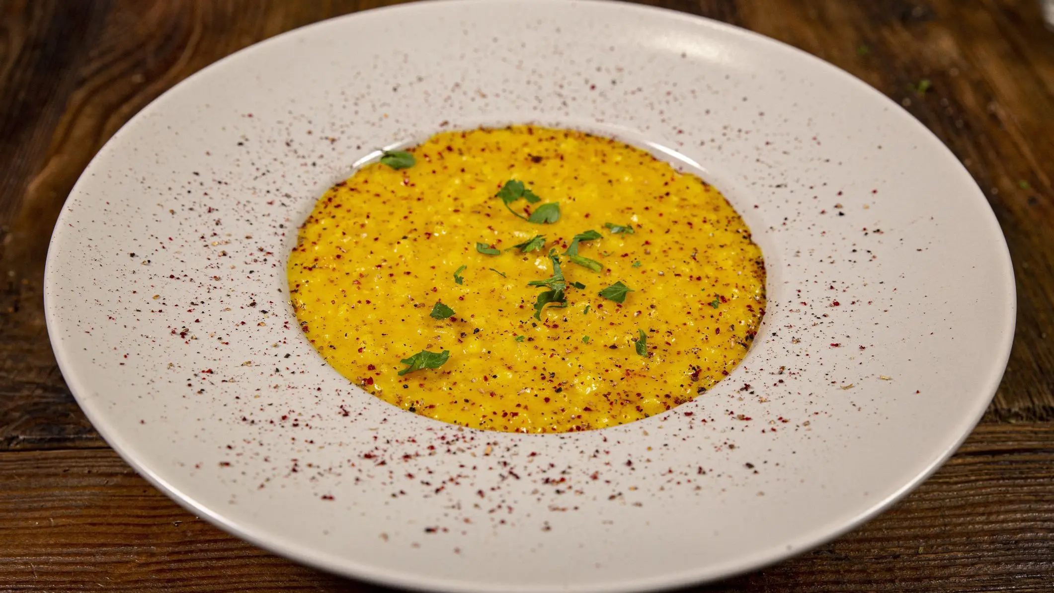 Close up of a plate of risotto with saffron, a staple of the best Swiss food.