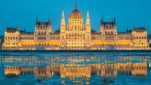 The Hungarian Parliament Building and its reflection on the icy water of the Danube River.