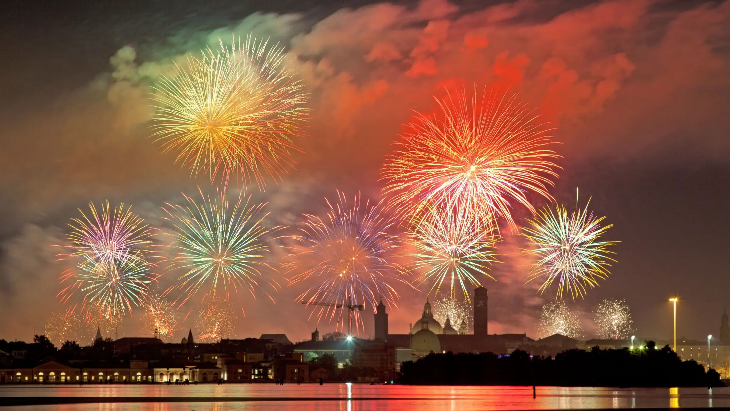 The sky of Venice lit up by impressive fireworks.