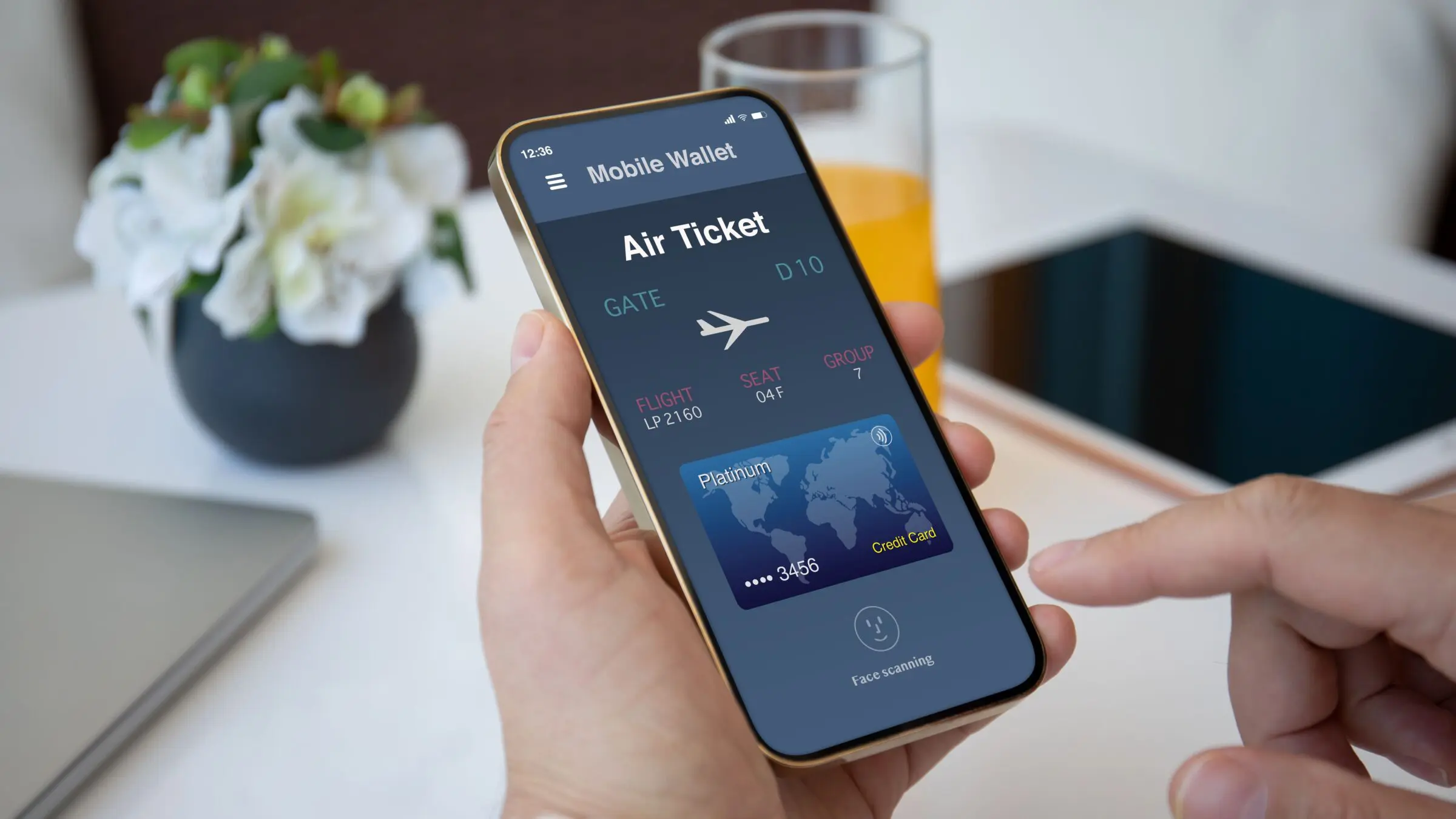 A man's hands are holding a smartphone with an airplane ticket application on the screen.
