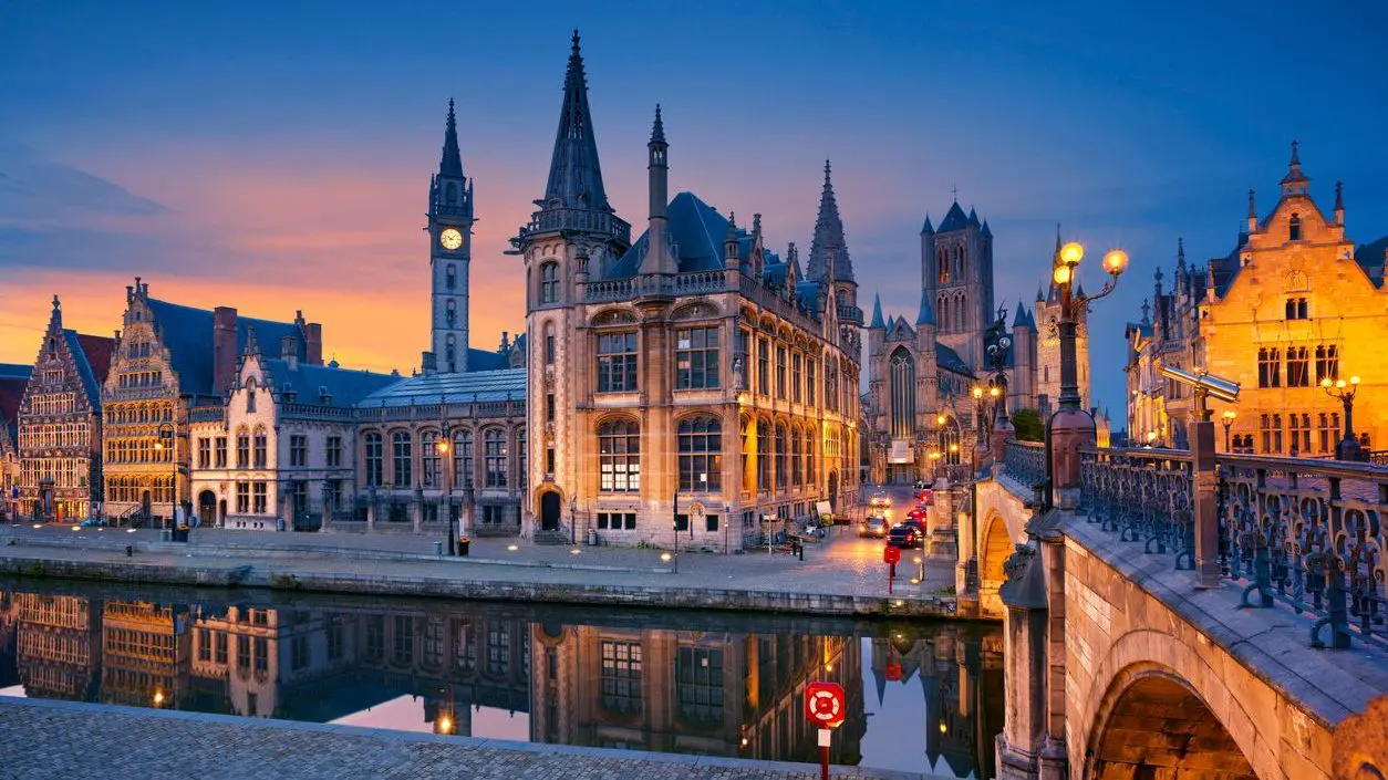 A panoramic view of Ghent Old Town in the blue hour.
