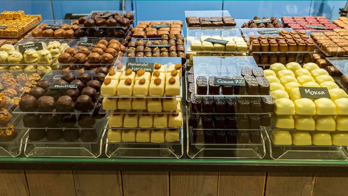 Various chocolates at a chocolatier's in Bruges, one of the best places to visit in Belgium.