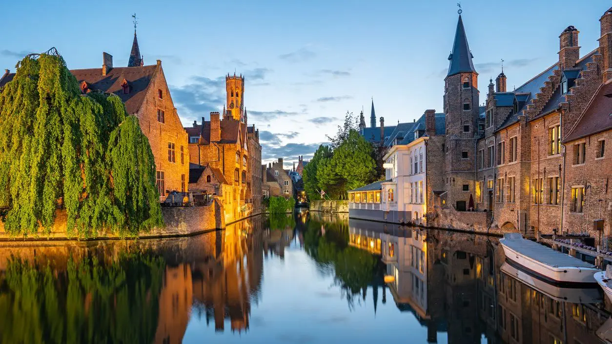 Bruges skyline with old buildings at twilight.