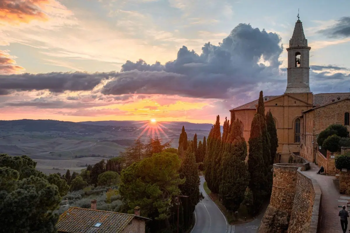 Sunset in Pienza with a view of the rolling hills of Val d'Orcia.