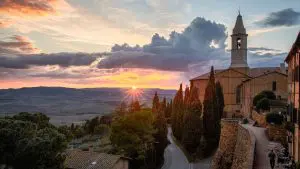 Sunset in Pienza with a view of the rolling hills of Val d'Orcia.