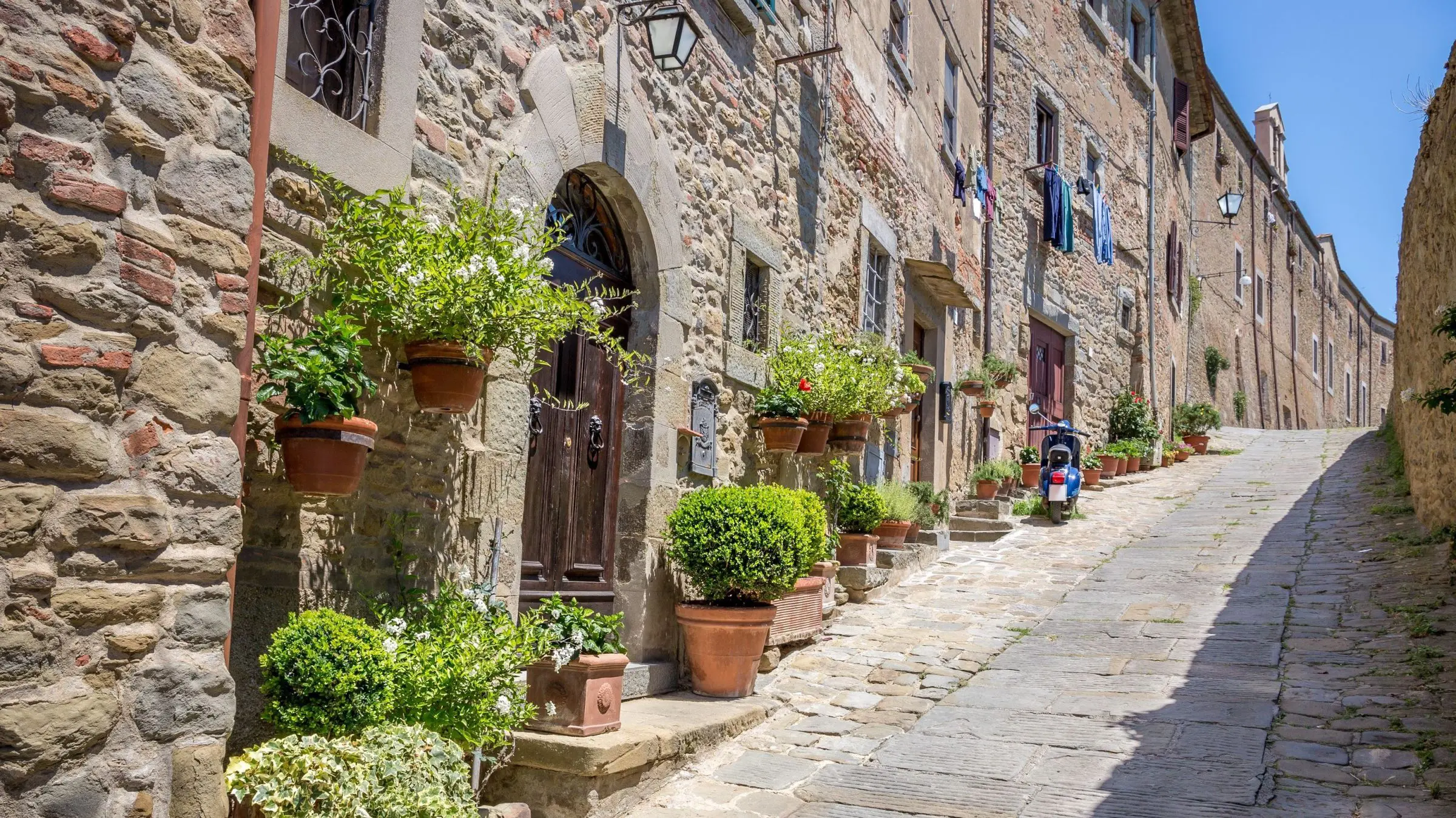 A picturesque street in Cortona, one of the must-see places in Tuscany.