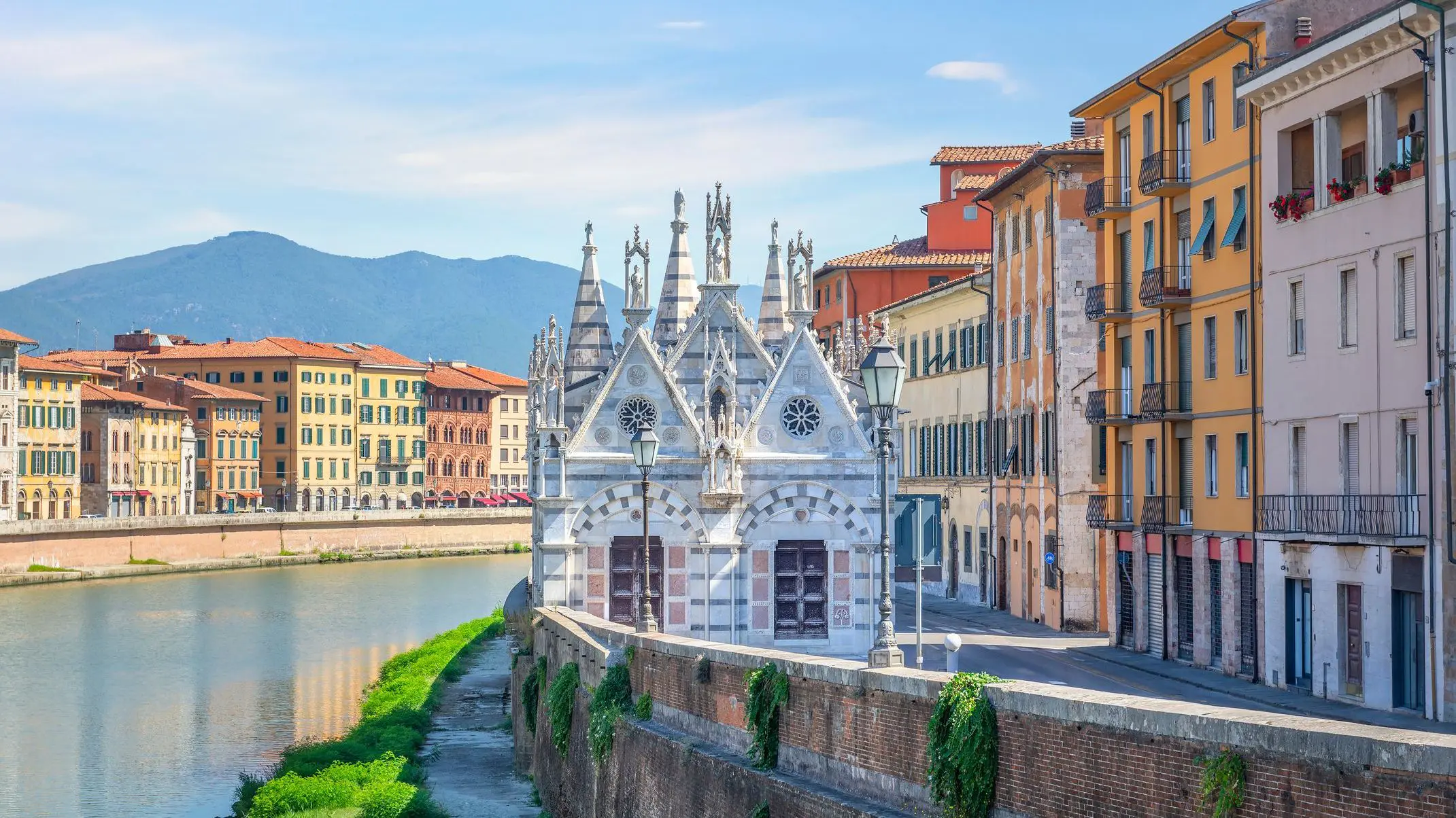 The riverside Church of Santa Maria della Spina in Pisa, one of the must-see places in Tuscany.