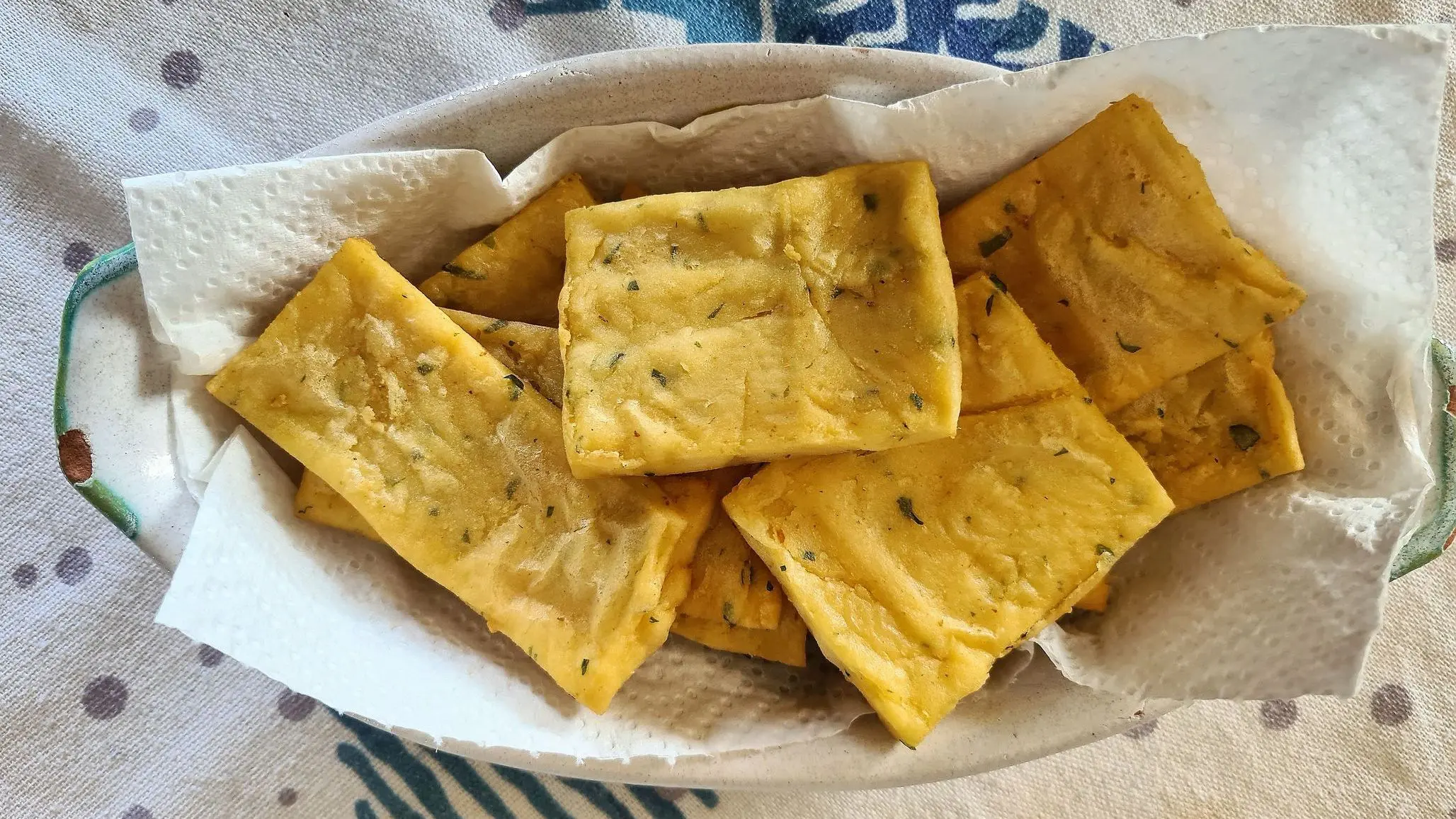 Traditional Sicilian pancakes made of chickpea flour and parsley.