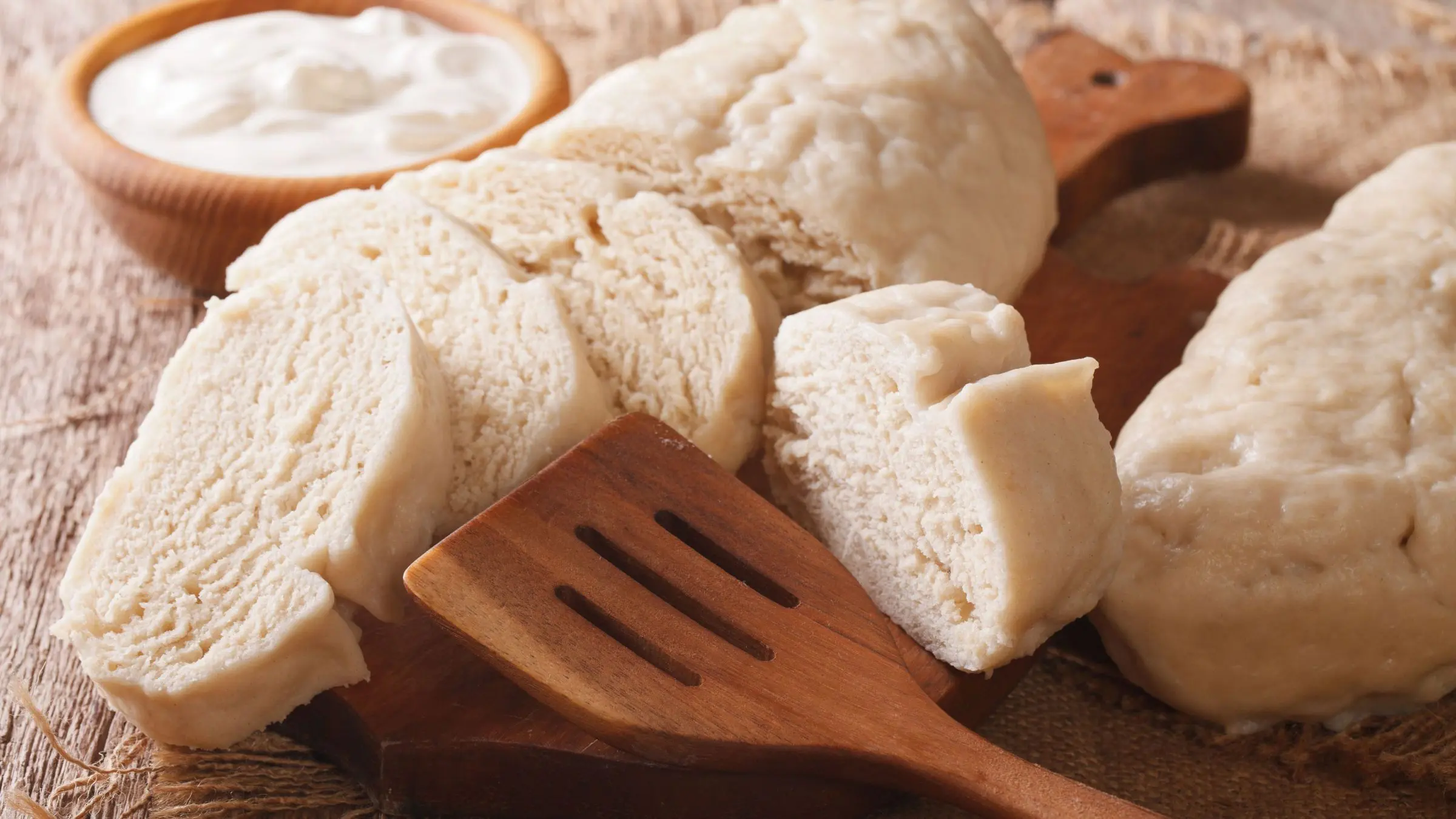A close-up of freshly cut bread dumplings, which are often served as a side to the best food in the Czech Republic.