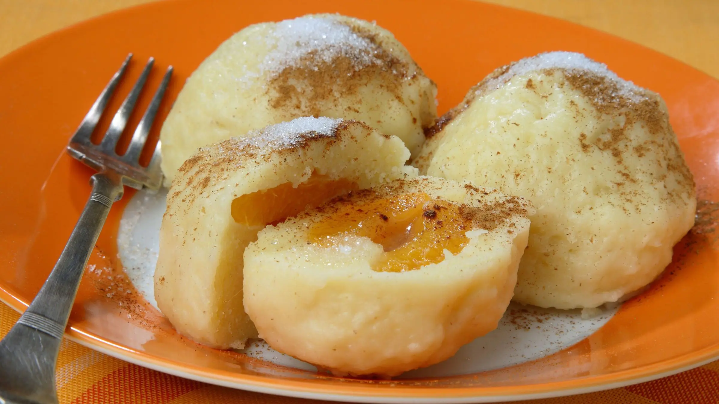 Three potato dumplings filled with apricots.