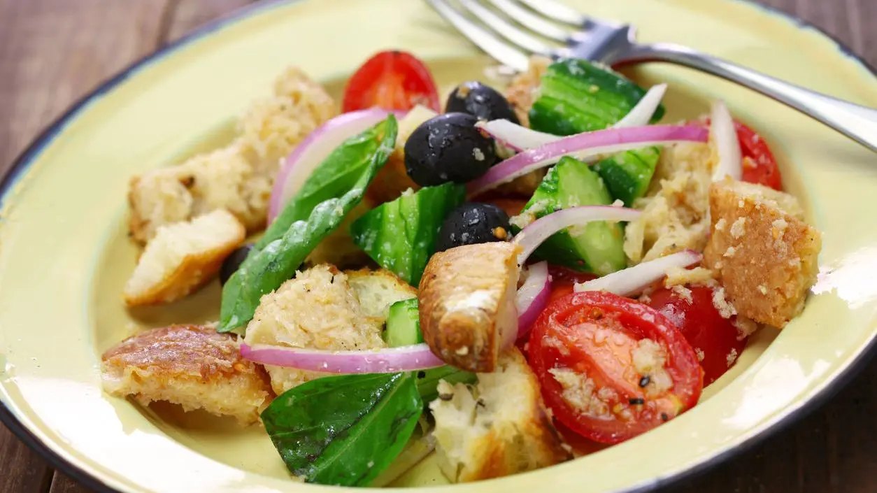 A close-up of a bread and tomato salad.
