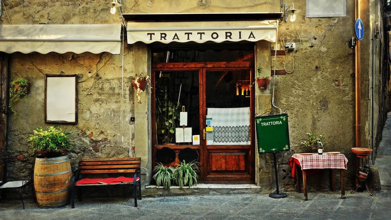 The entrance of an old Italian restaurant in Tuscany.