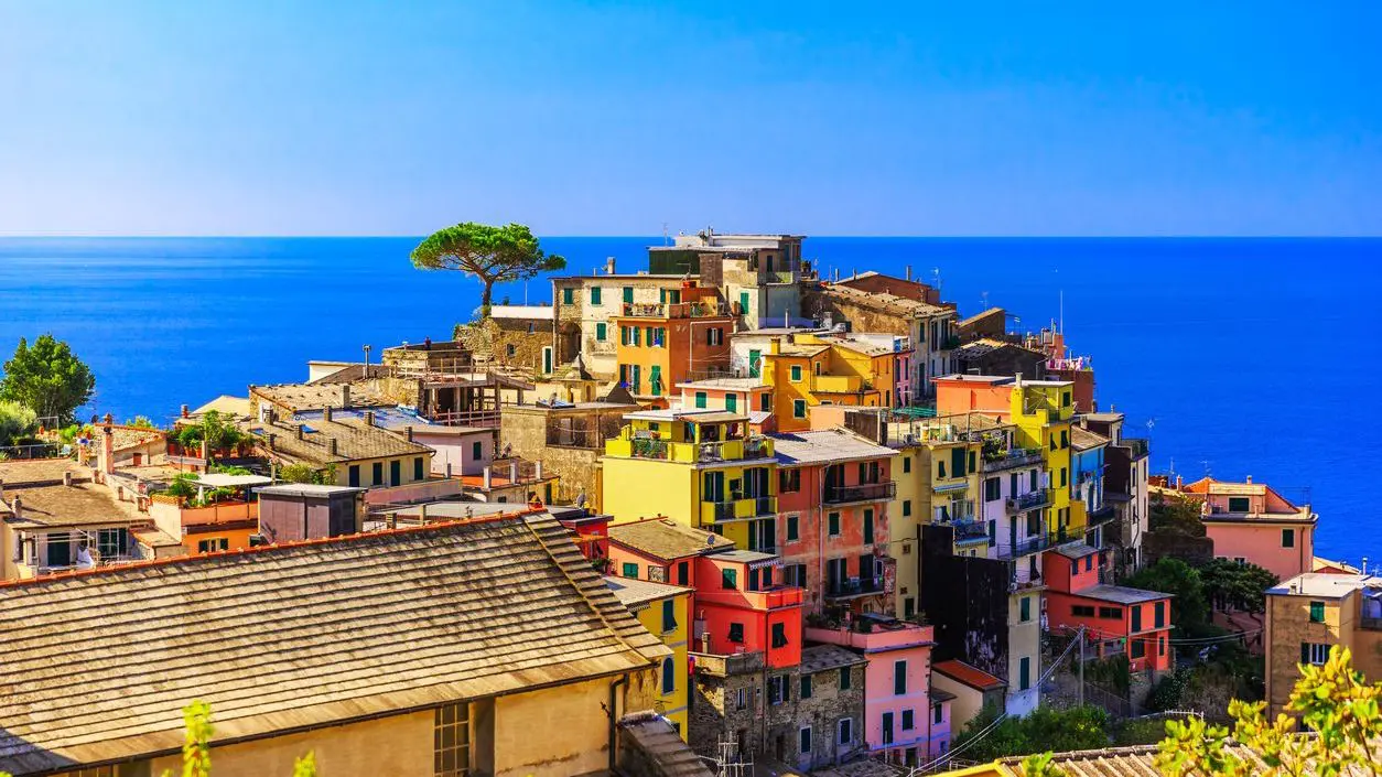 Colorful houses atop a hill in Corniglia, one of the best places to visit in Cinque Terre. 