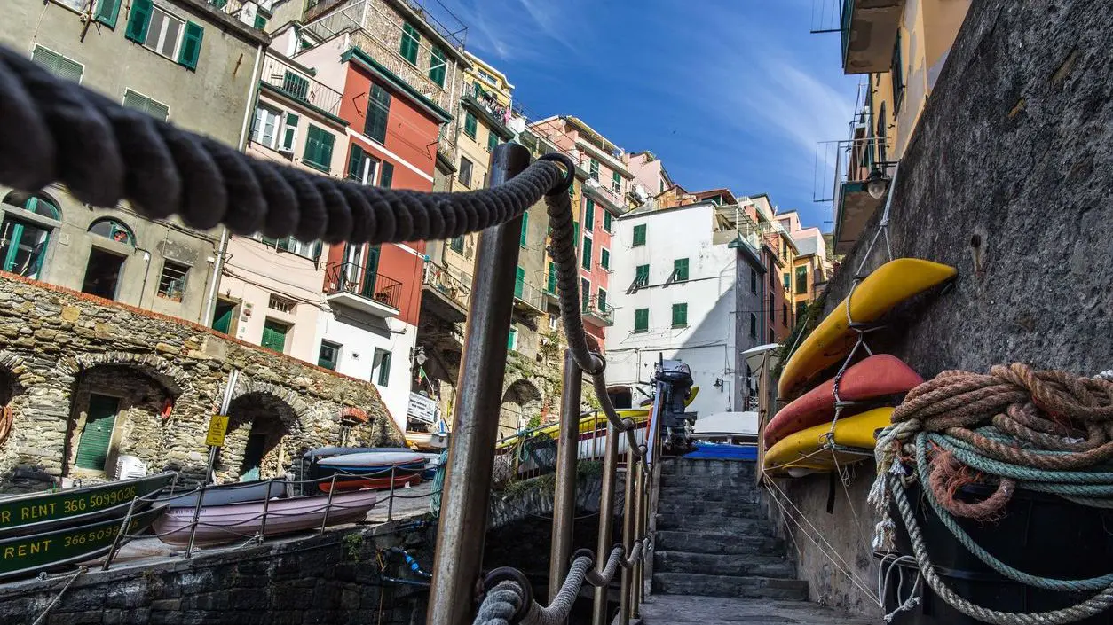 Several canoes in the town of Riomaggiore. 