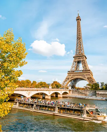View on the Eiffel tower on Seine river during the autumn in Paris
