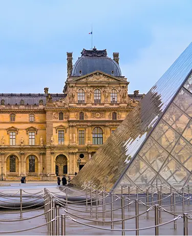 The Louvre Museum and Louvre Pyramid in Paris, France