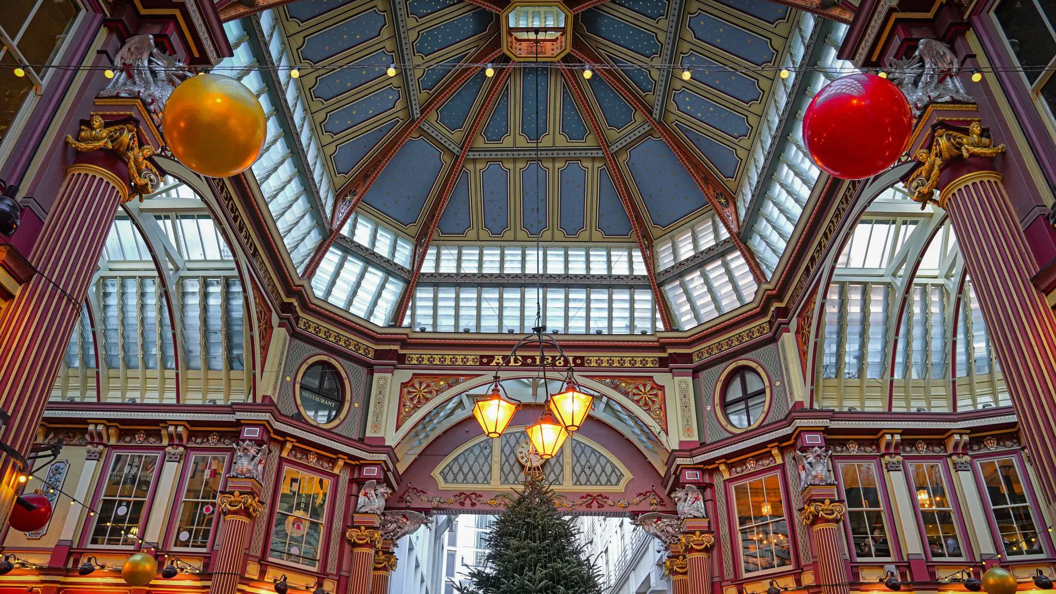 Leadenhall Market at Christmas, London, United Kingdom. There's a Christmas tree and other festive decorations.