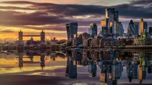 Beautiful autumn sunset view of the skyline of London, England, with reflections in the River Thames.
