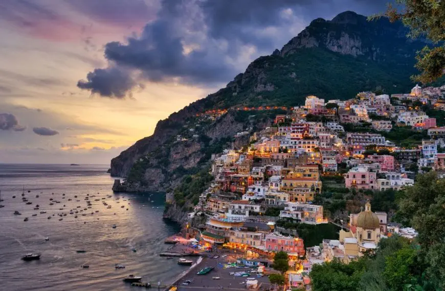 A panoramic view of colorful Positano at sunset.